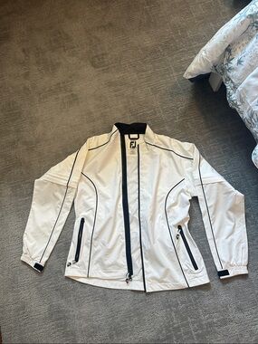 Footjoy/Dryjoys Lightweight White Jacket with Black Trim- used. See photos.